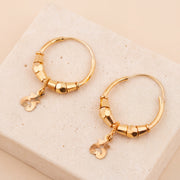 Hoop Earrings D39- (V1) on travertine