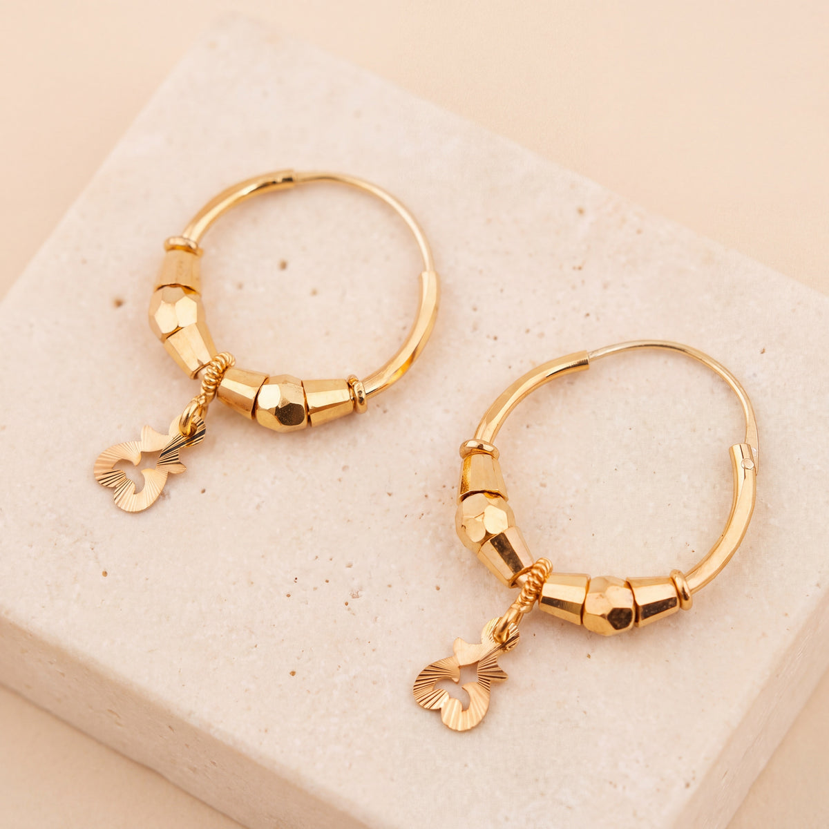 Hoop Earrings D39- (V1) on travertine