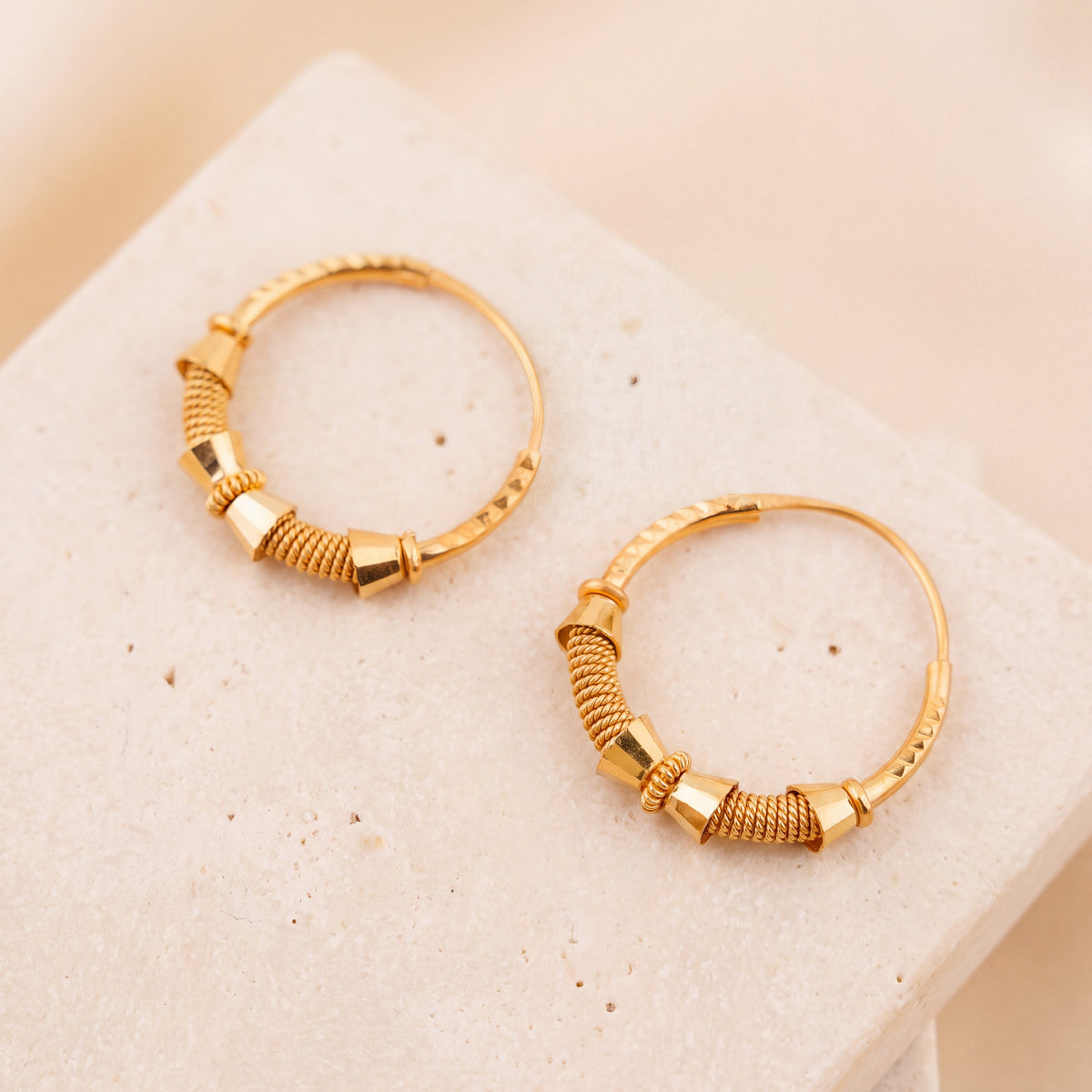 Hoop Earrings D42- (V1) on travertine