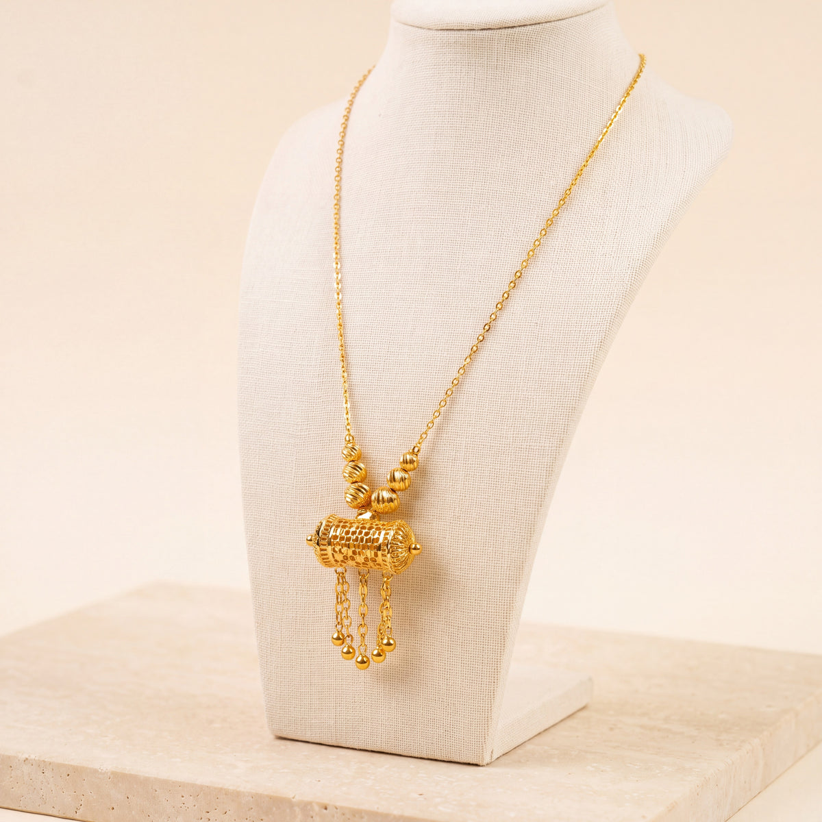Kids Barrel Mala Necklace 17 on travertine