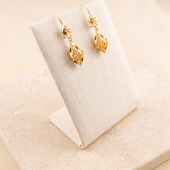Kids Casting Earrings 39 on travertine