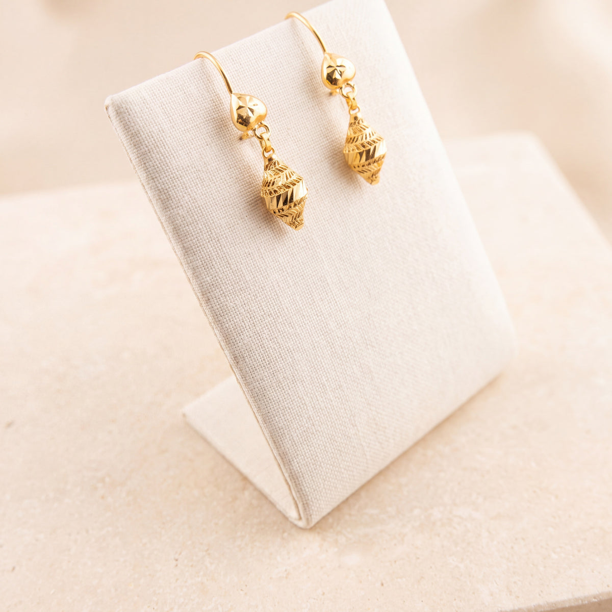Kids Casting Earrings 40 on travertine