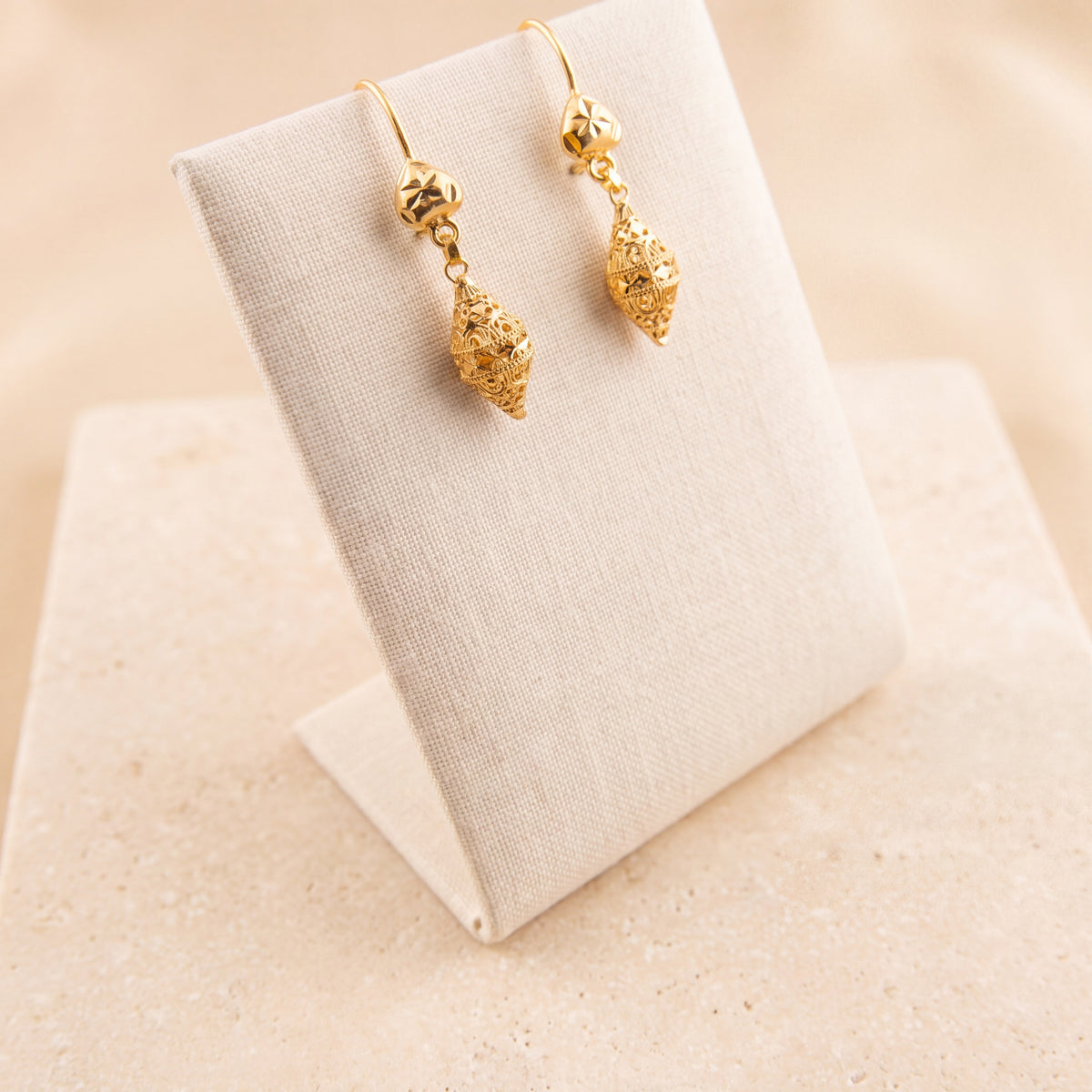Kids Casting Earrings 41 on travertine