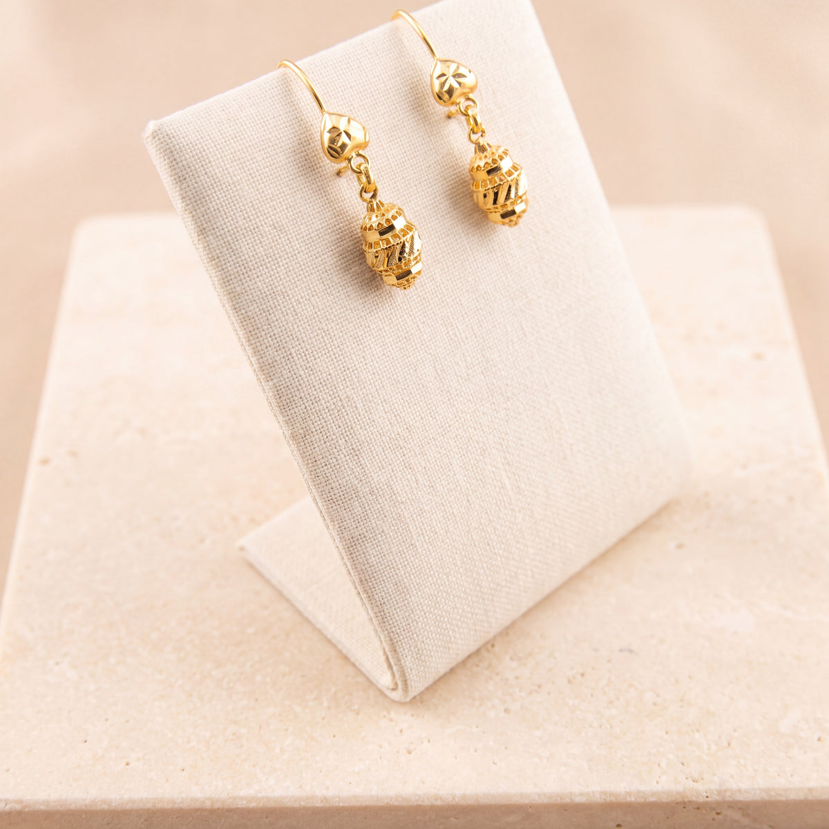 Kids Casting Earrings 42 on travertine