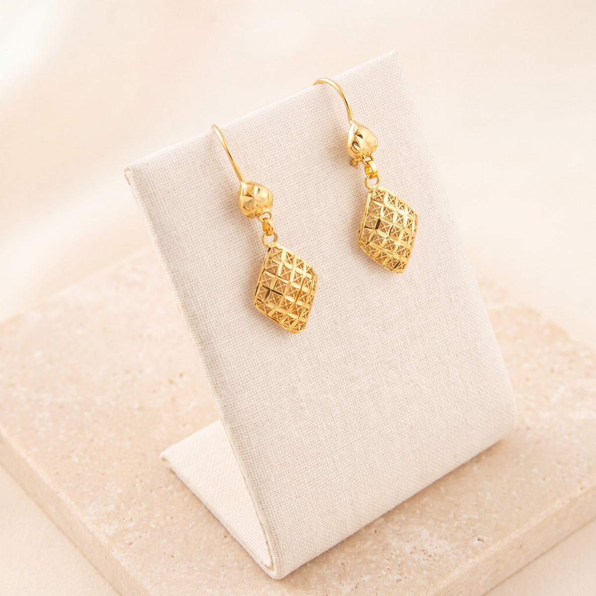 Kids Casting Earrings 49 on travertine
