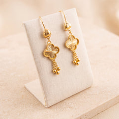 Kids Four-Leaf Clover Earrings 2 on travertine
