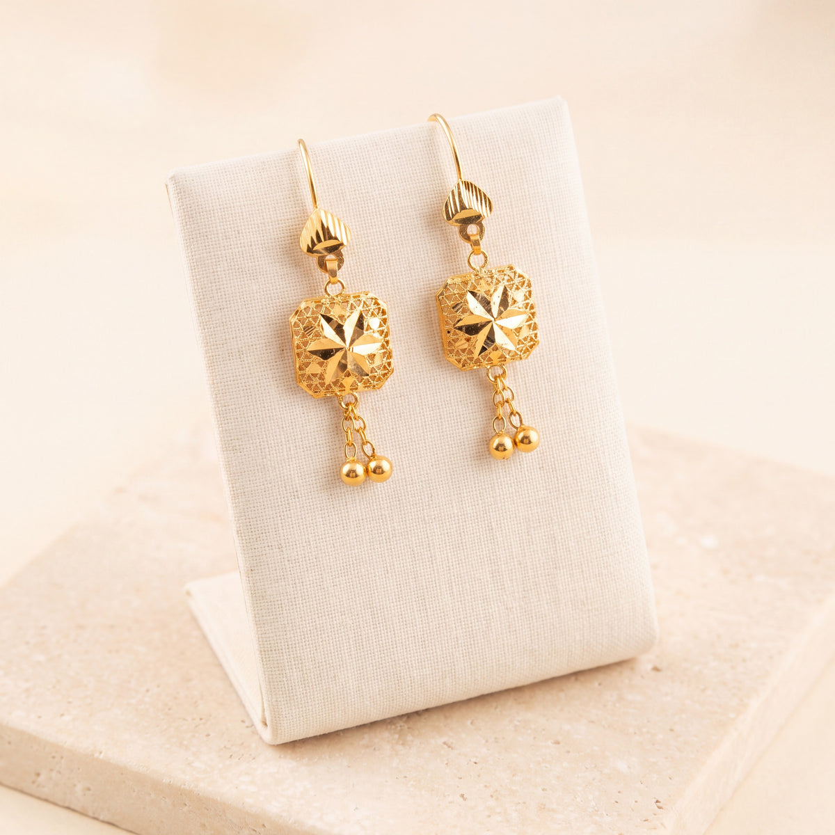 Kids Frame Earrings 2 on travertine