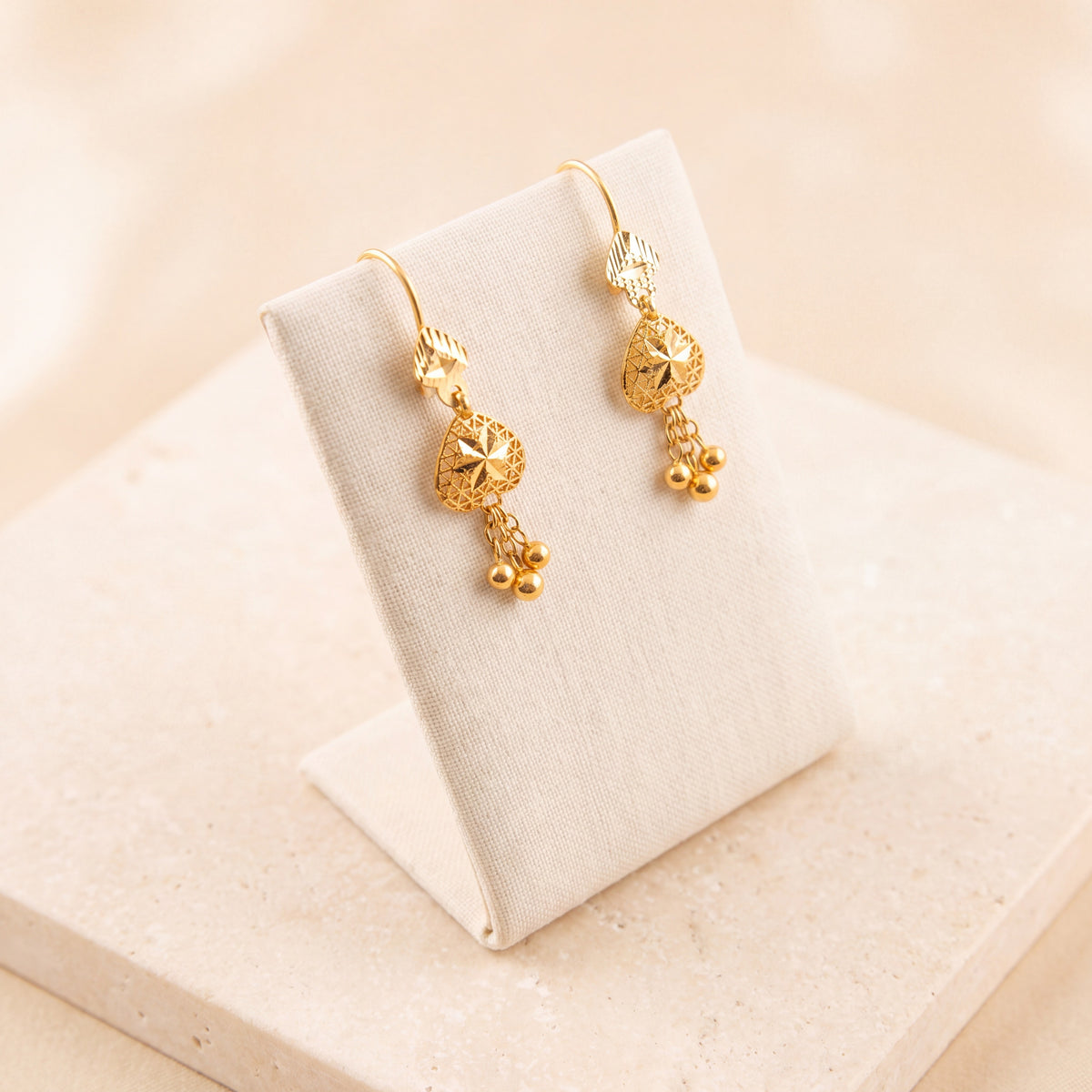 Kids Heart Earrings 2 on travertine