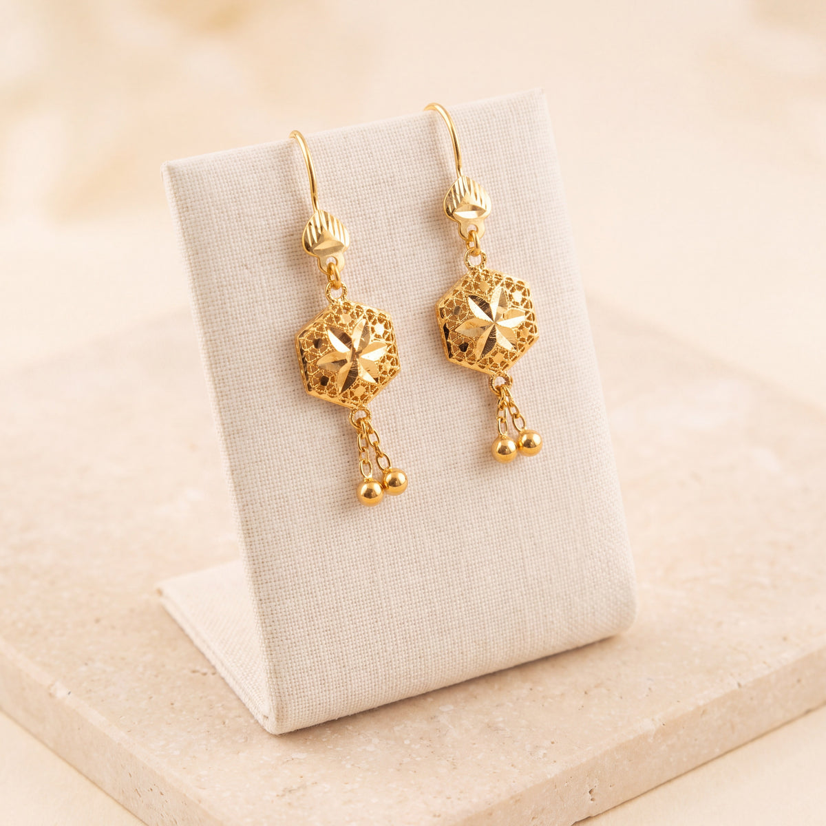 Kids Hexa Earrings 2 on travertine