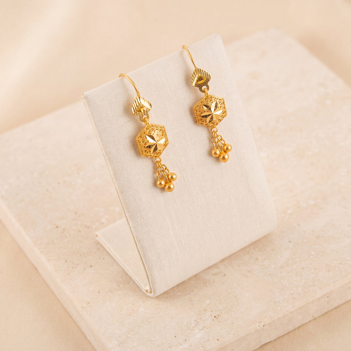 Kids Hexa Earrings 3 on travertine