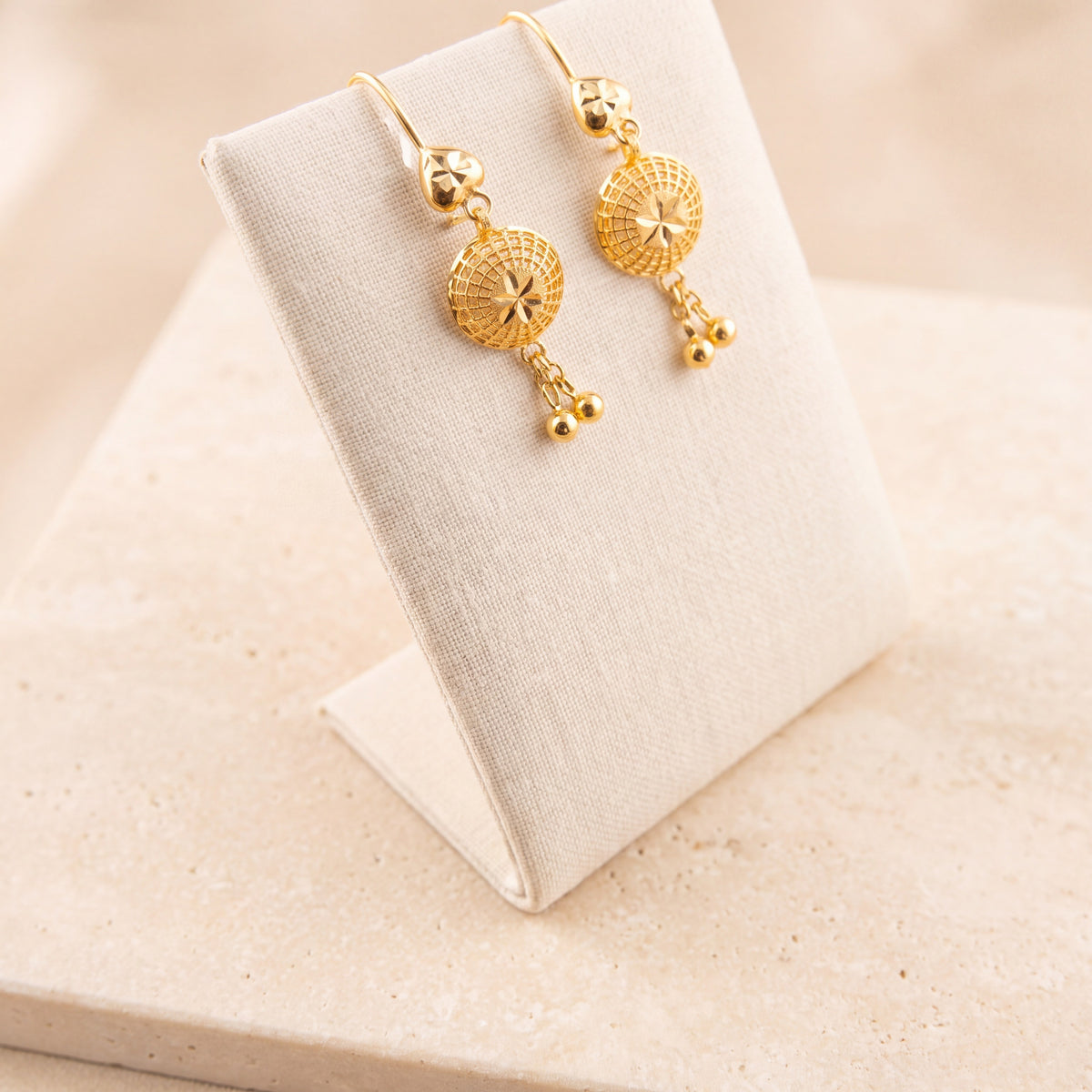 Kids RP Earrings 2 – Heart top, on travertine