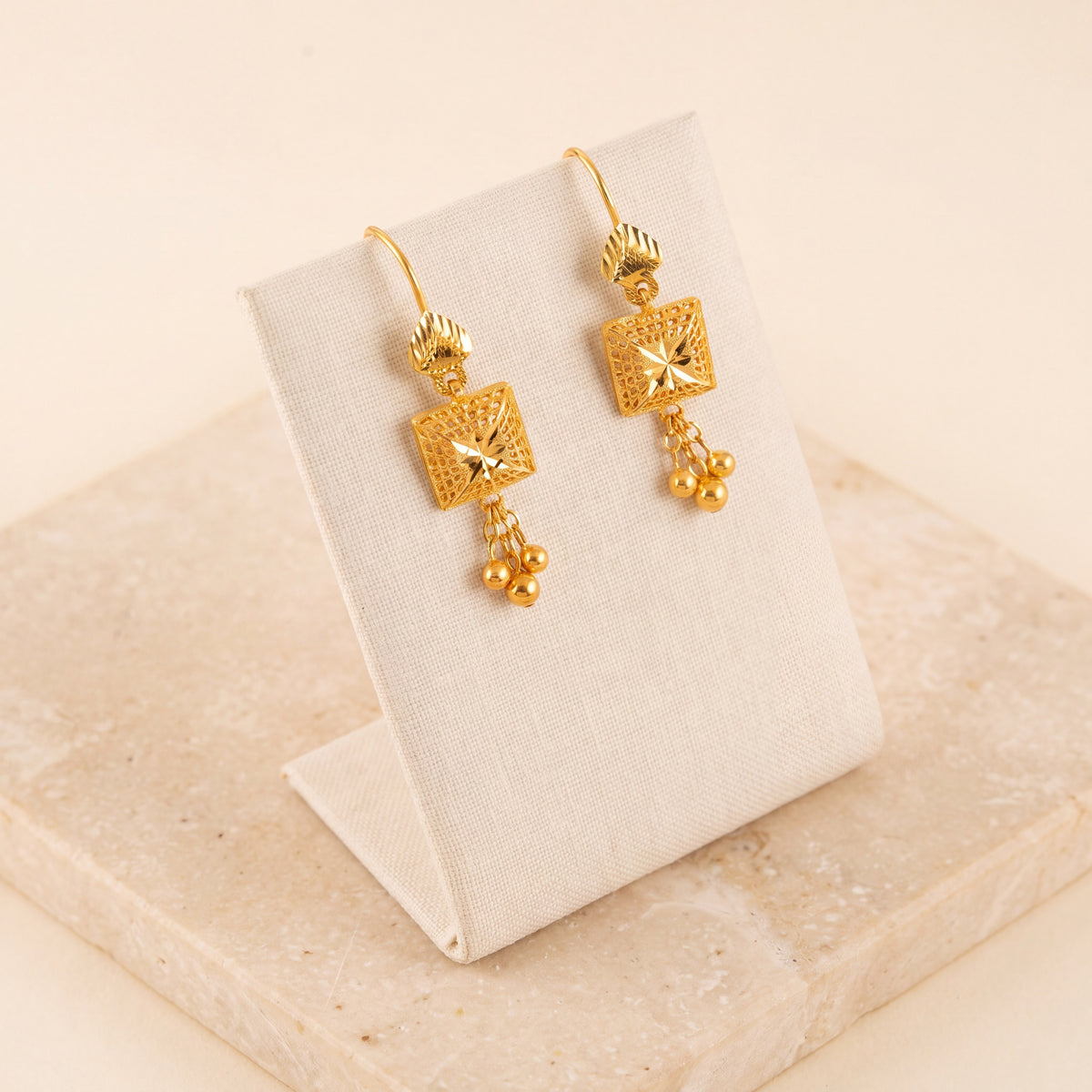Kids RP Earrings 3 on travertine