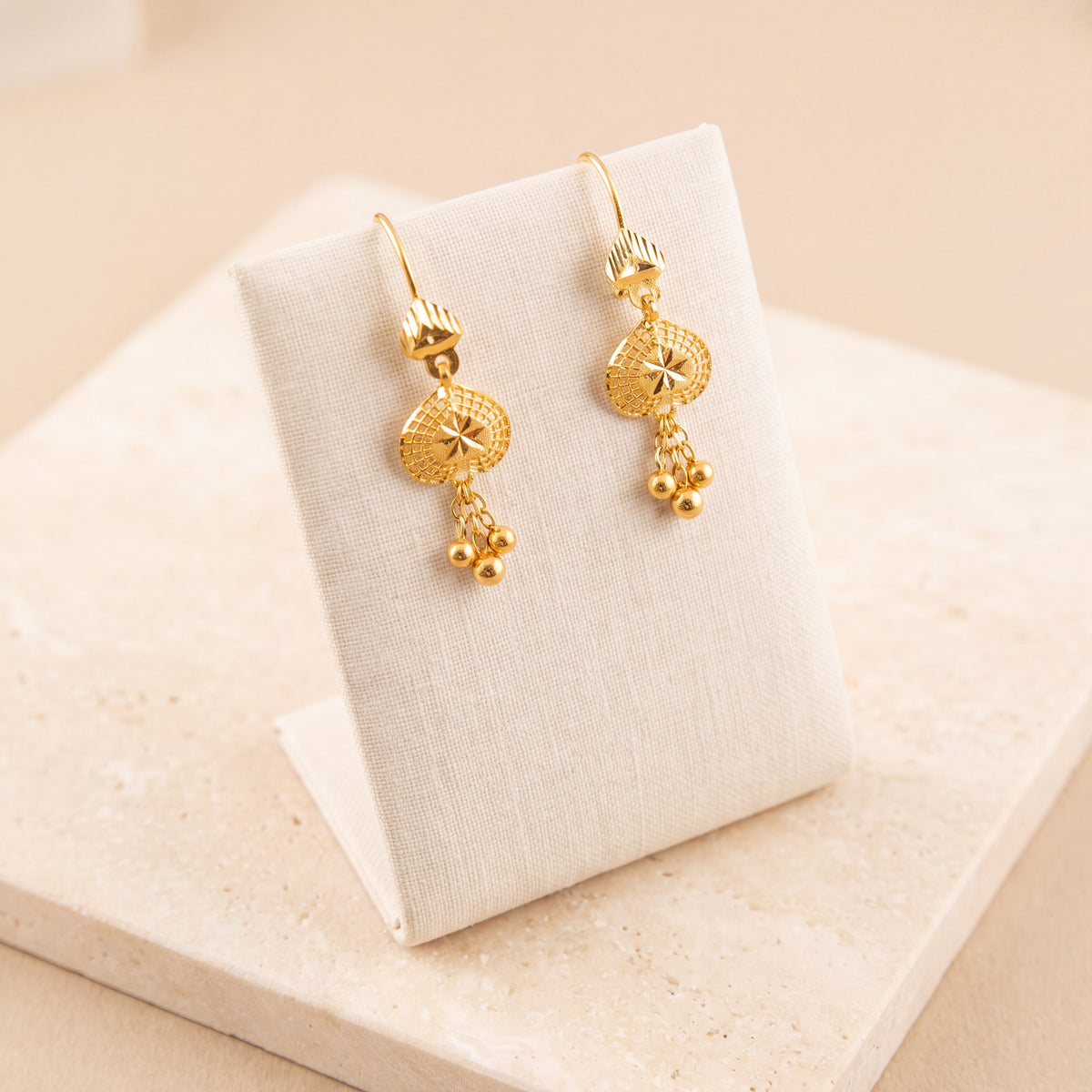 Kids RP Earrings 4 – Starburst pattern, on travertine