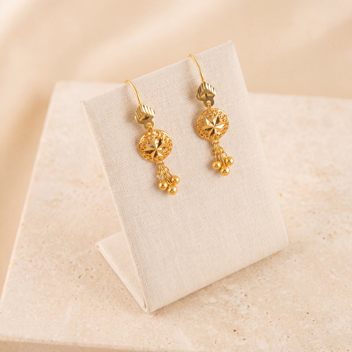 Kids Sphere Earrings 2 on travertine