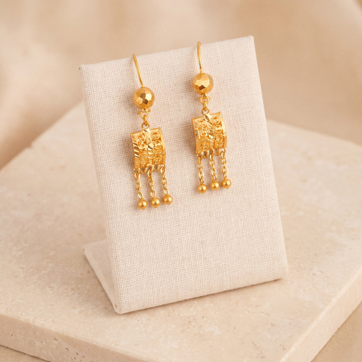 Kids Square Earrings 4 on travertine