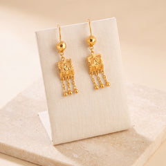Kids Square Earrings 5 on travertine