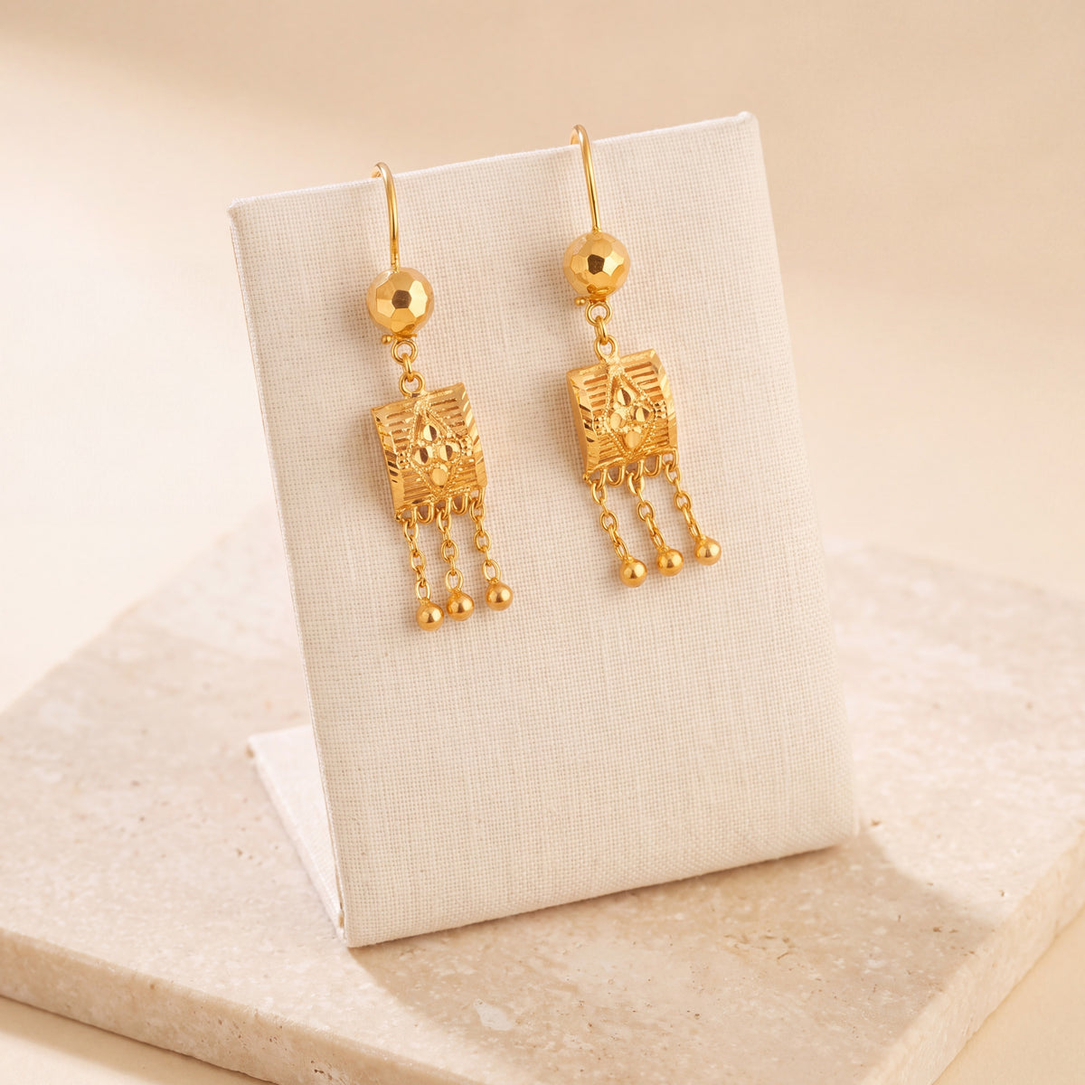 Kids Square Earrings 5 on travertine