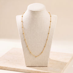 Link with Ball Chain 1 on travertine
