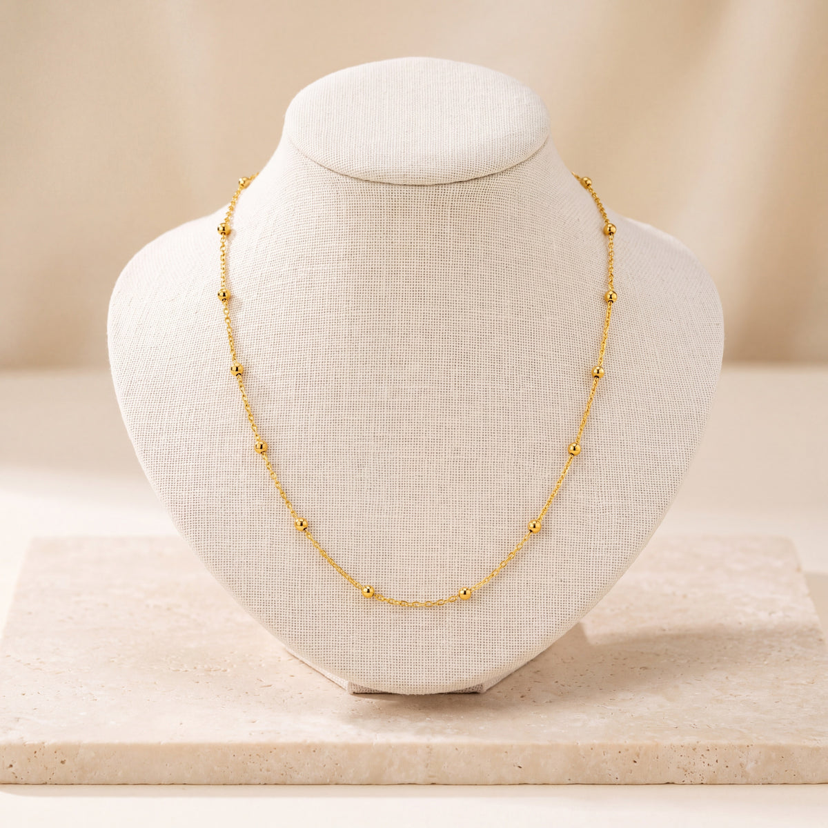 Link with Ball Chain 2 on travertine