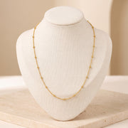 Link with Ball Chain 4 on travertine