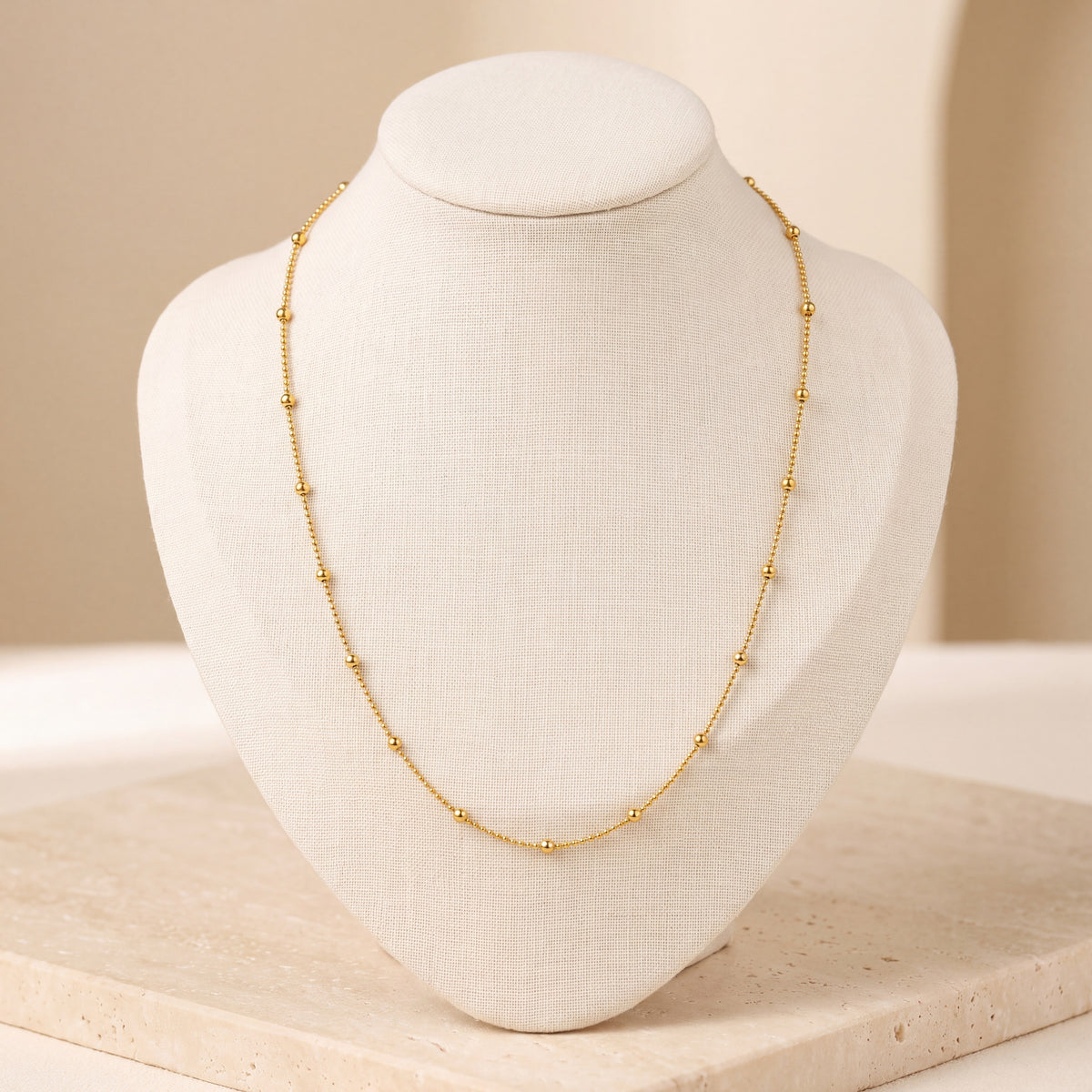 Link with Ball Chain 4 on travertine