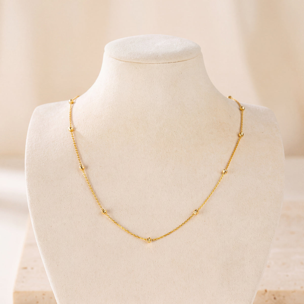 Link with Ball Chain 5 on travertine