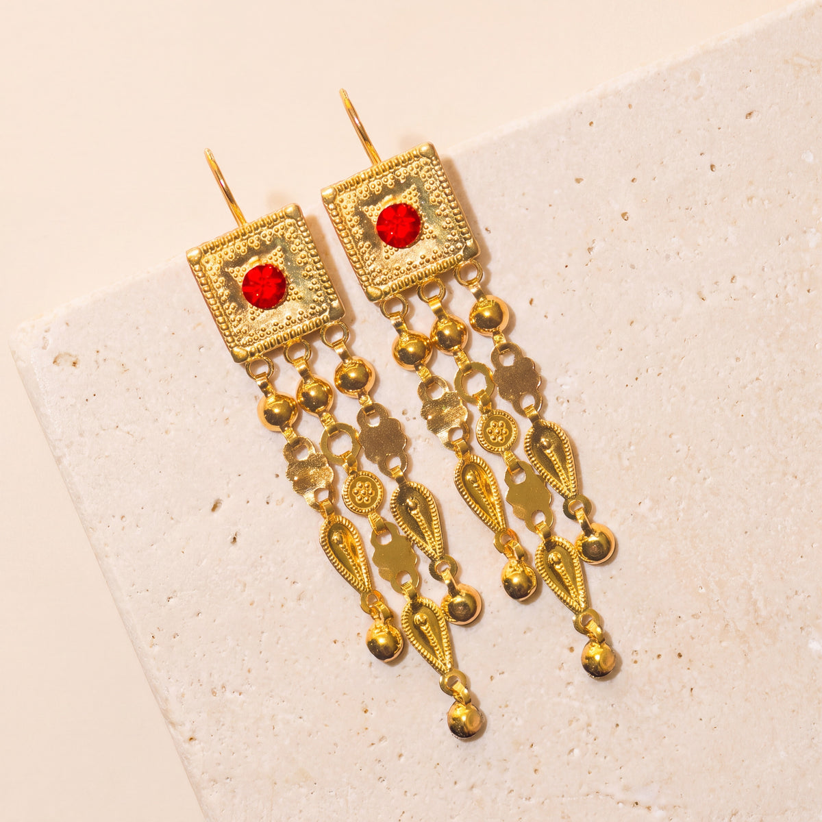 Martasha Earrings on travertine