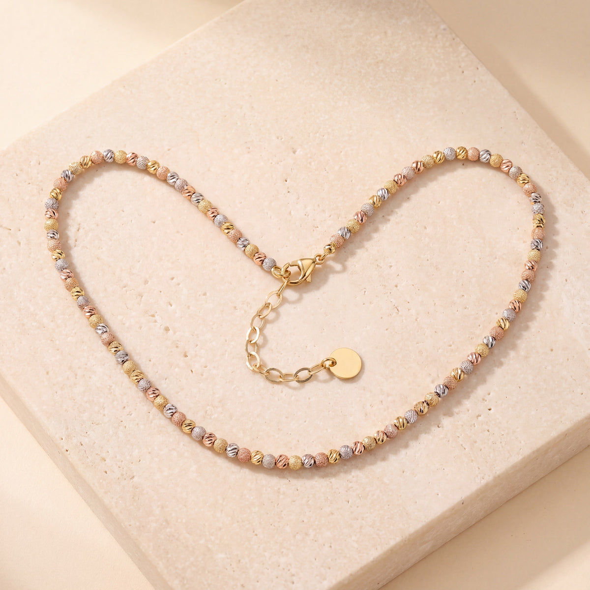 Multi Color Dorika Chain 1 laid flat on travertine
