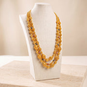 Multi Line Mala Necklace 4 on travertine