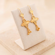 Petal Flower Earrings 3 – Gold clover with dangles, on travertine