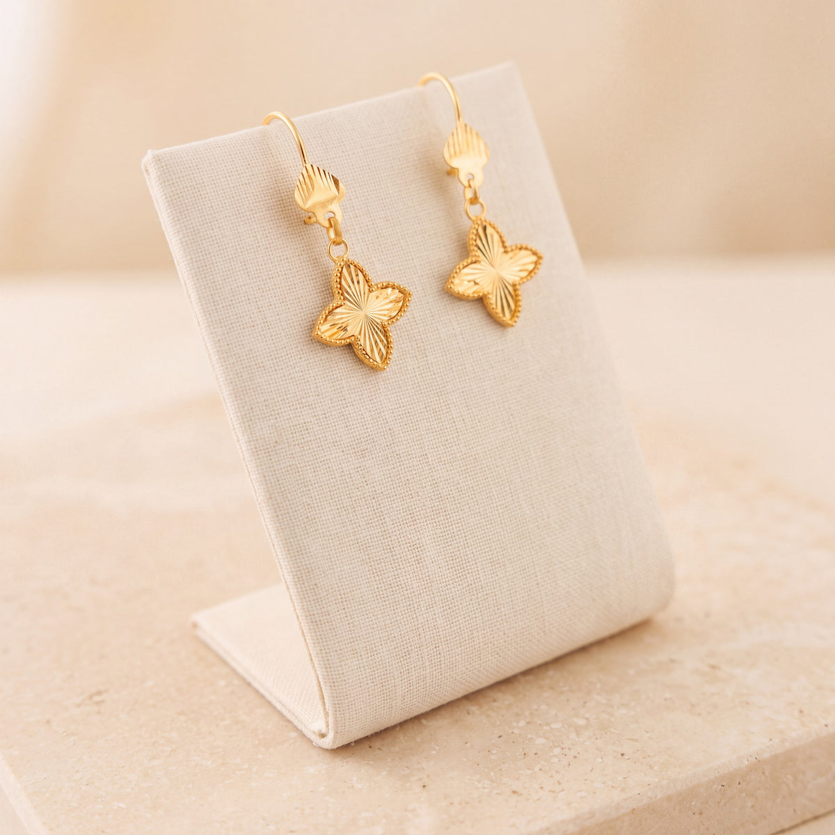 Petal Flower Earrings 3 – Gold clover without dangles, on travertine