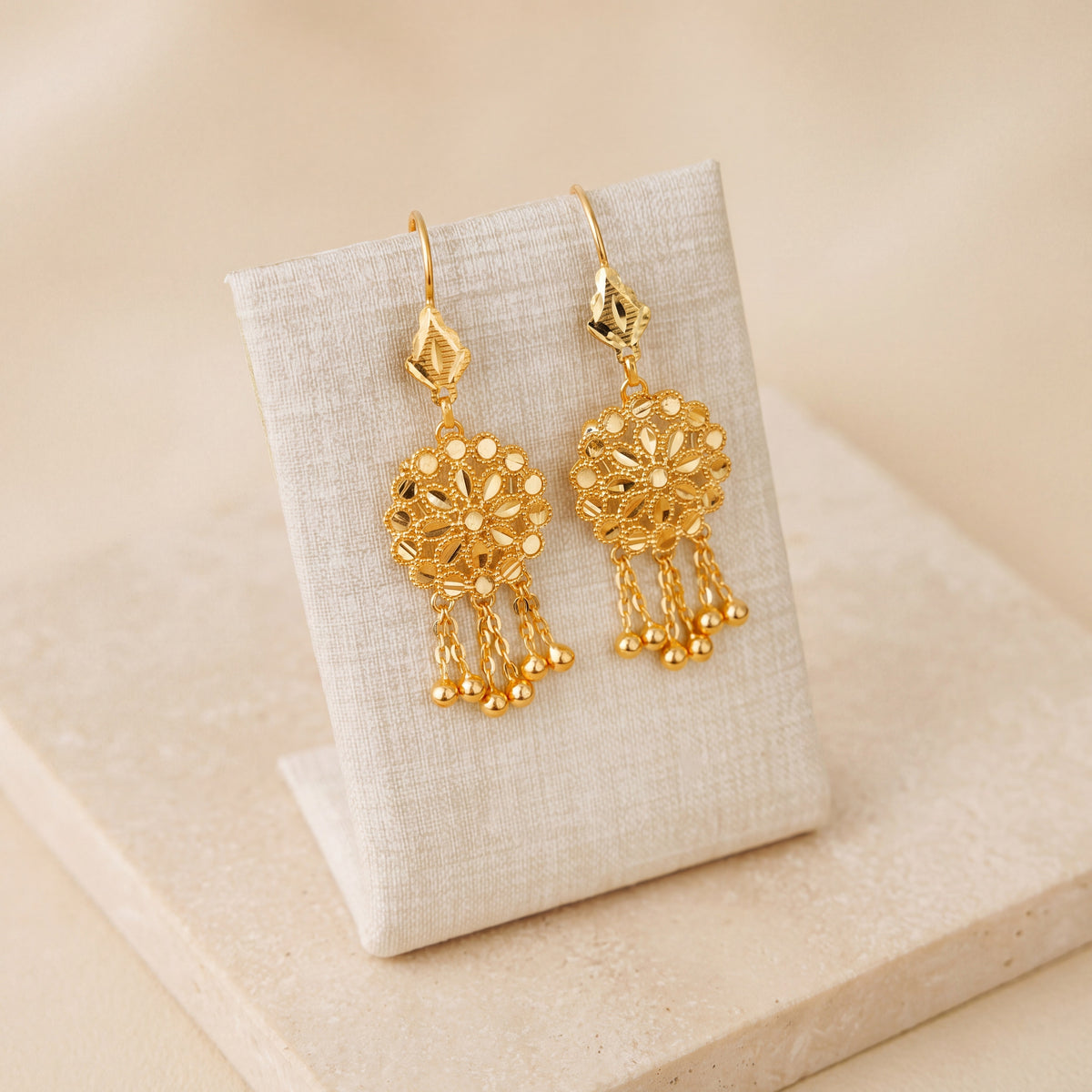 RP Earrings 1 – 5 ball dangles, on travertine