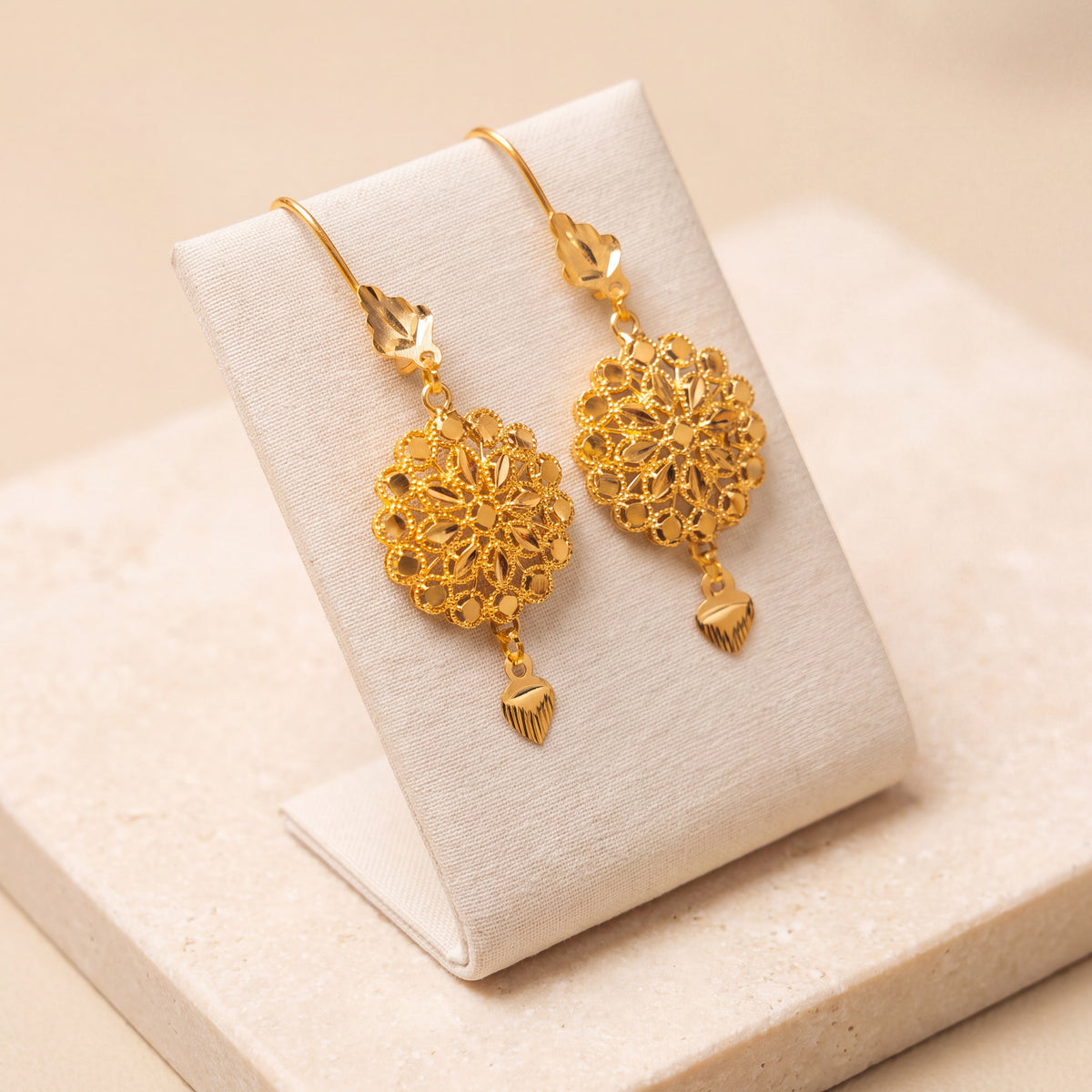RP Earrings 1 – Single heart dangle, on travertine
