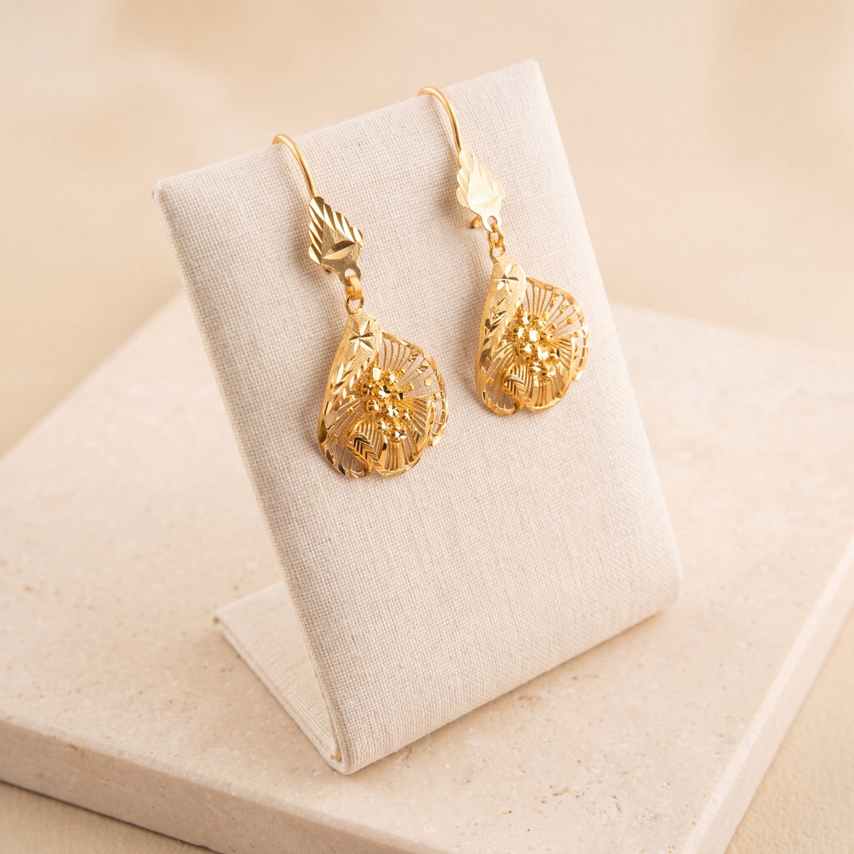 RP Earrings 20 on travertine