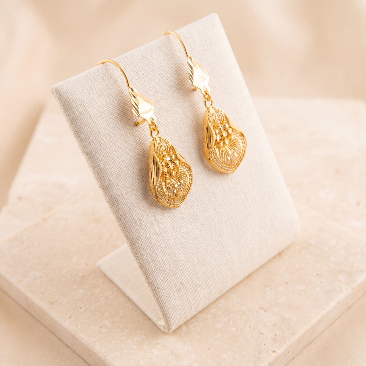 RP Earrings 21 on travertine