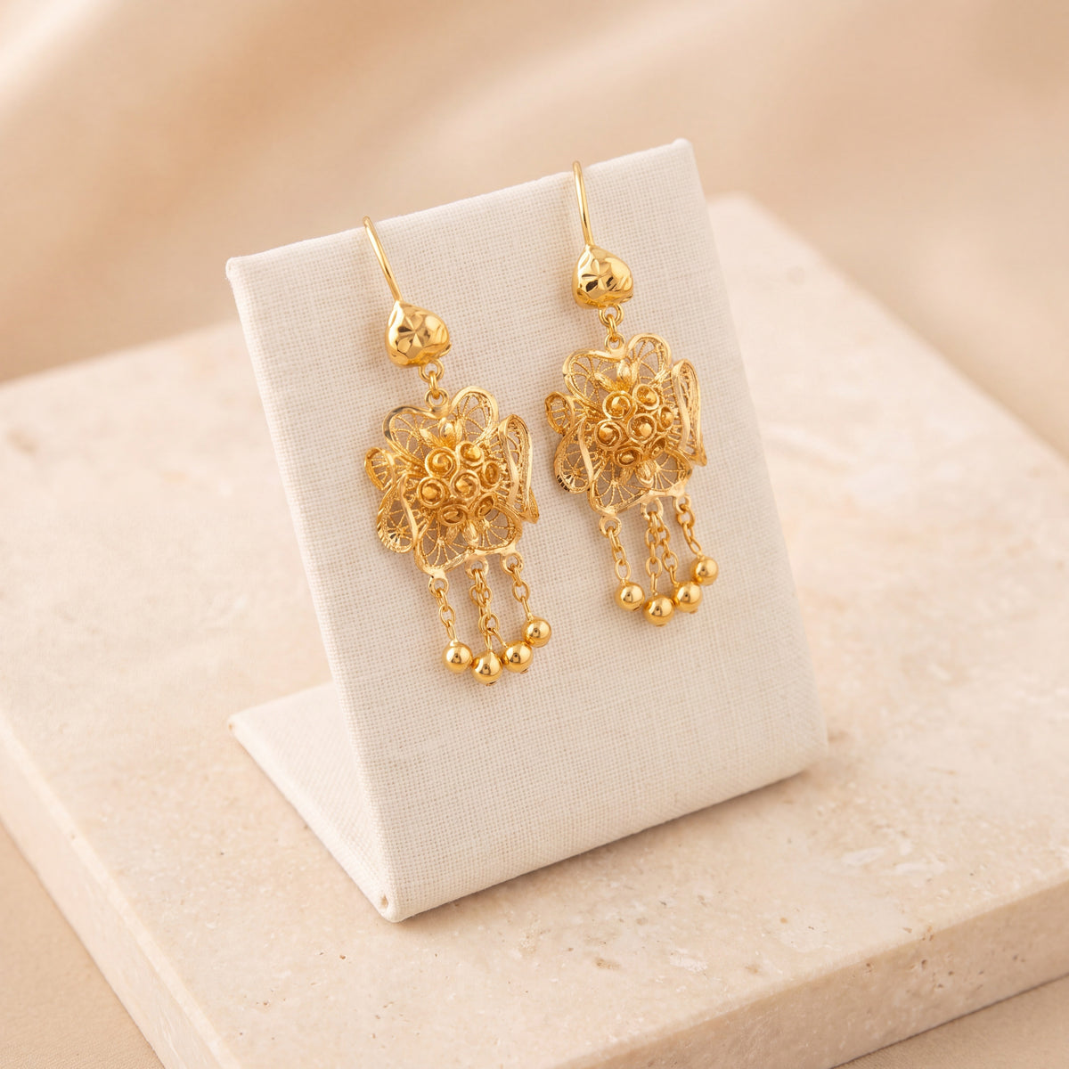 RP Earrings 22 on travertine