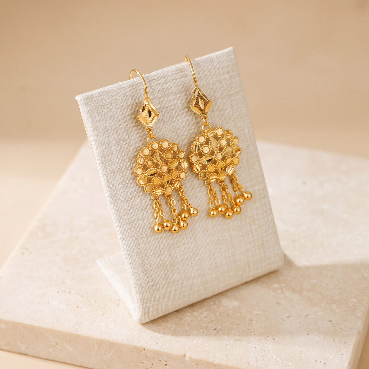 RP Earrings 4 – Diamond top, on travertine