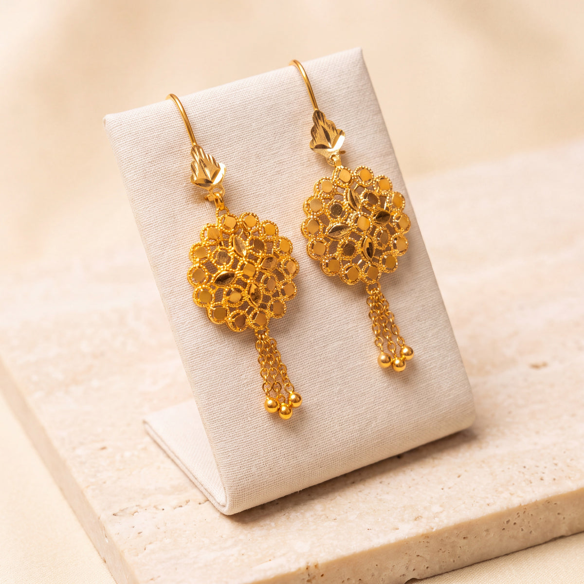 RP Earrings 4 – Leaf top, on travertine