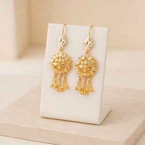 RP Earrings 5 – Gold earrings with 5 dangles, on travertine