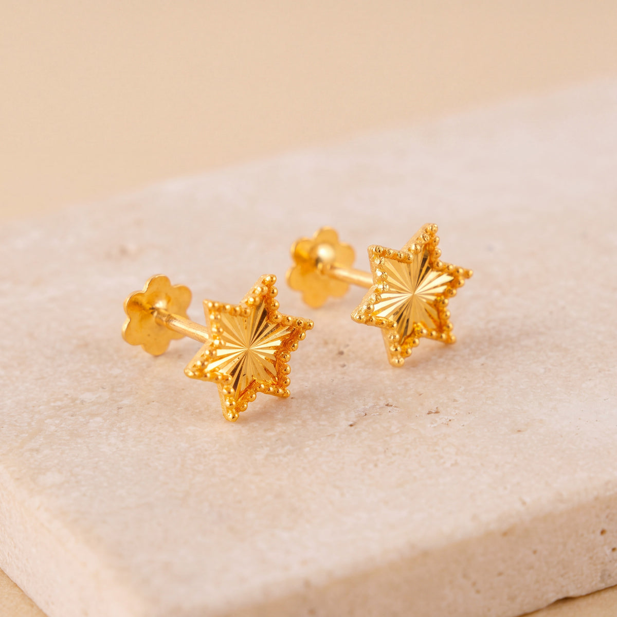 Star Stud Earrings 1 on travertine