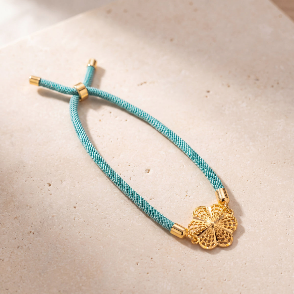 Flower Thread Bracelet on travertine