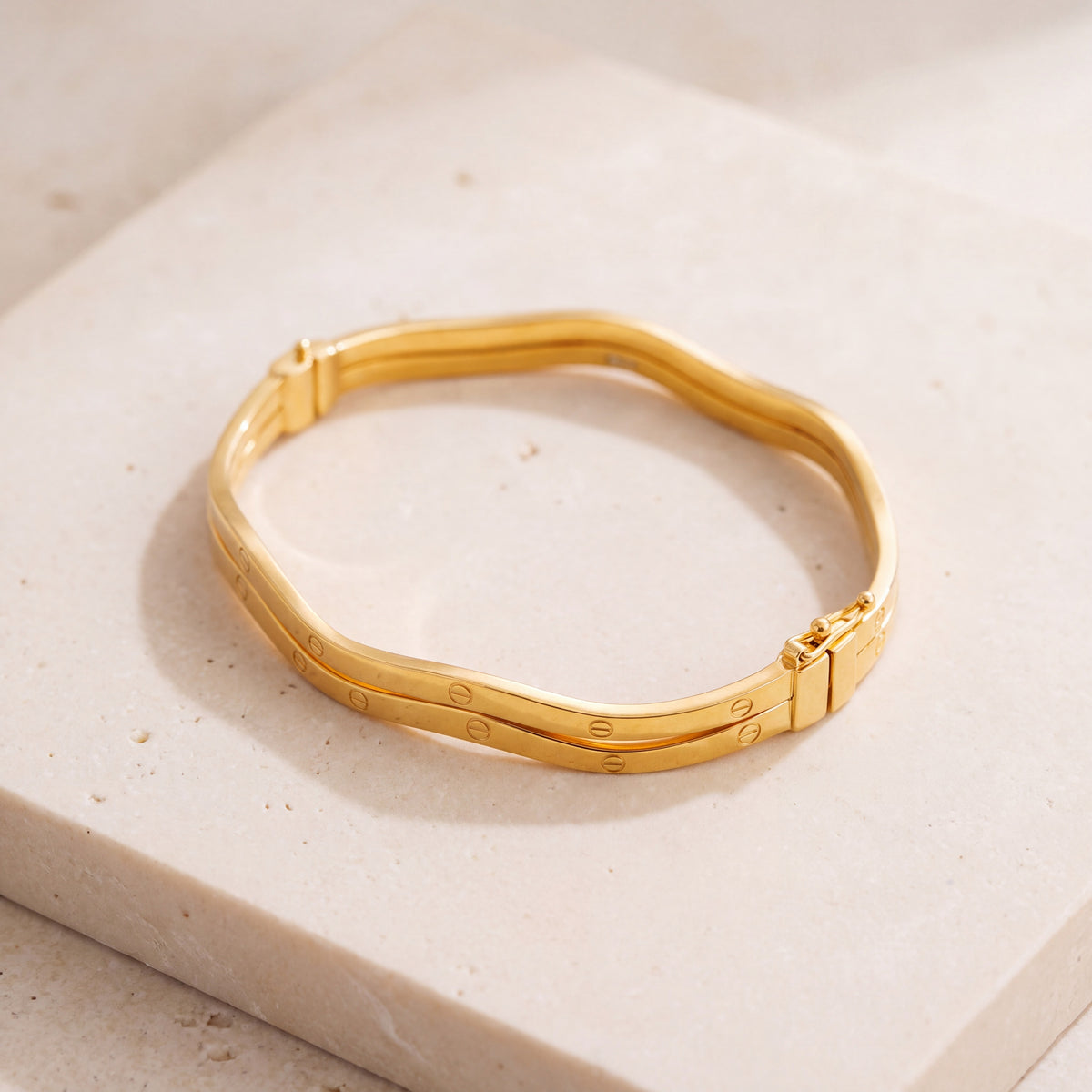 Gold Plated Cuff Bracelet (D1) on travertine