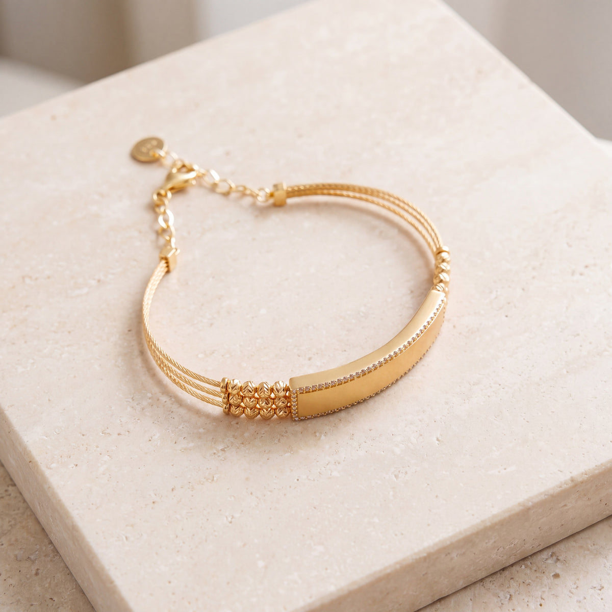 Gold Plated Cuff Bracelet (D10) on travertine