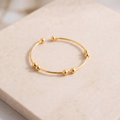 Gold Plated Cuff Bracelet (D2) on travertine