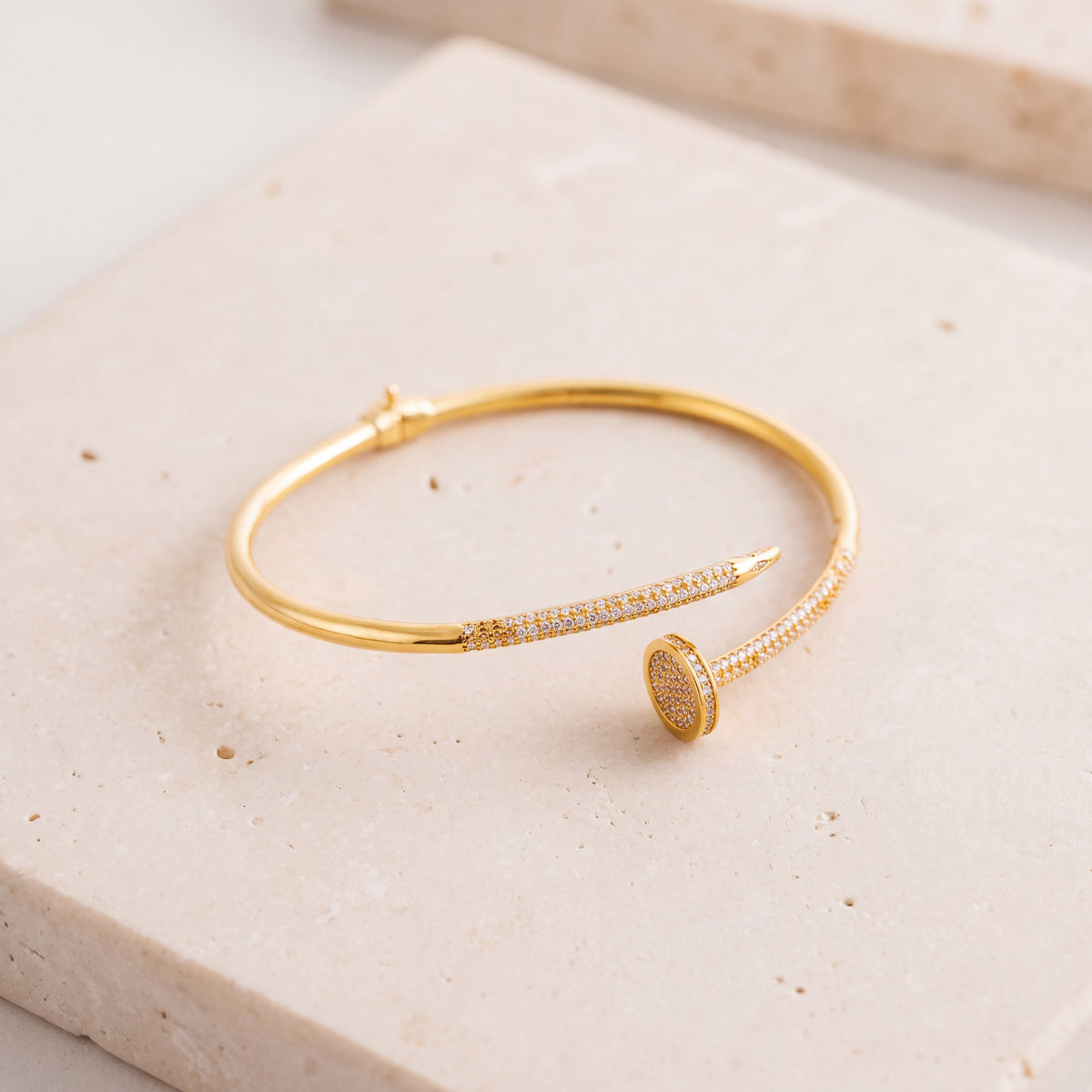Gold Plated Cuff Bracelet (D3) on travertine