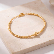 Gold Plated Cuff Bracelet (D5) on travertine