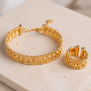 Gold Plated Cuff Bracelet & Ring (D1) on travertine