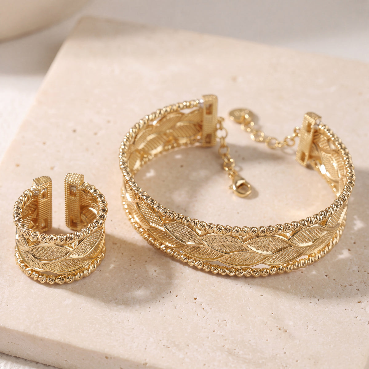 Gold Plated Cuff Bracelet & Ring (D24) on travertine