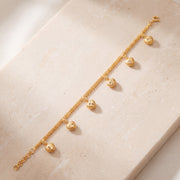 Heart Charm Bracelet (D1) on travertine