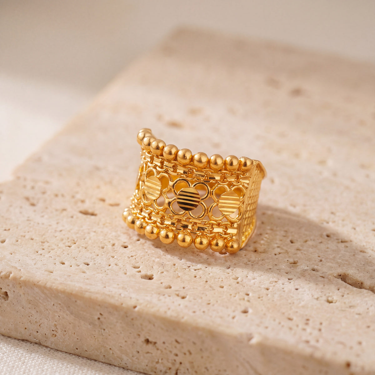Heritage Ring (D1) on travertine